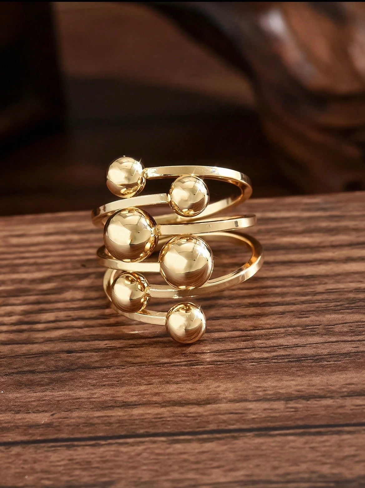 Gold Sphere and Bar Coil Ring